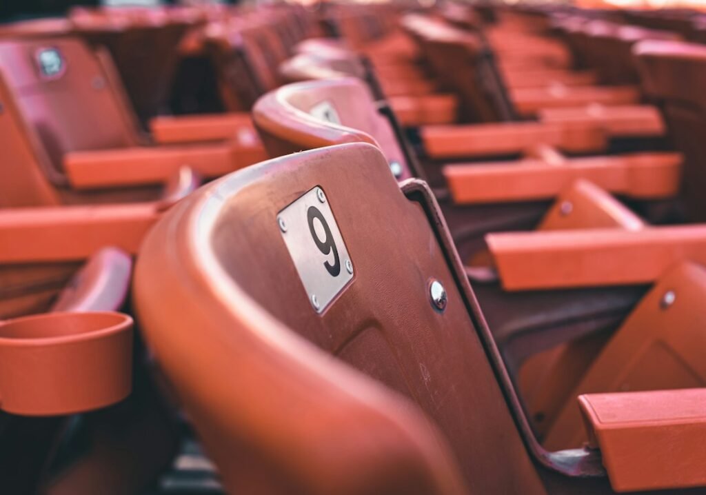 A row of seats with numbers on them